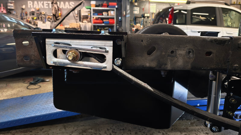 Custom rear leaf spring slider on the frame