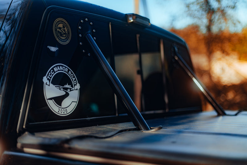 Custom roll bar passing through the polycarbonate rear window